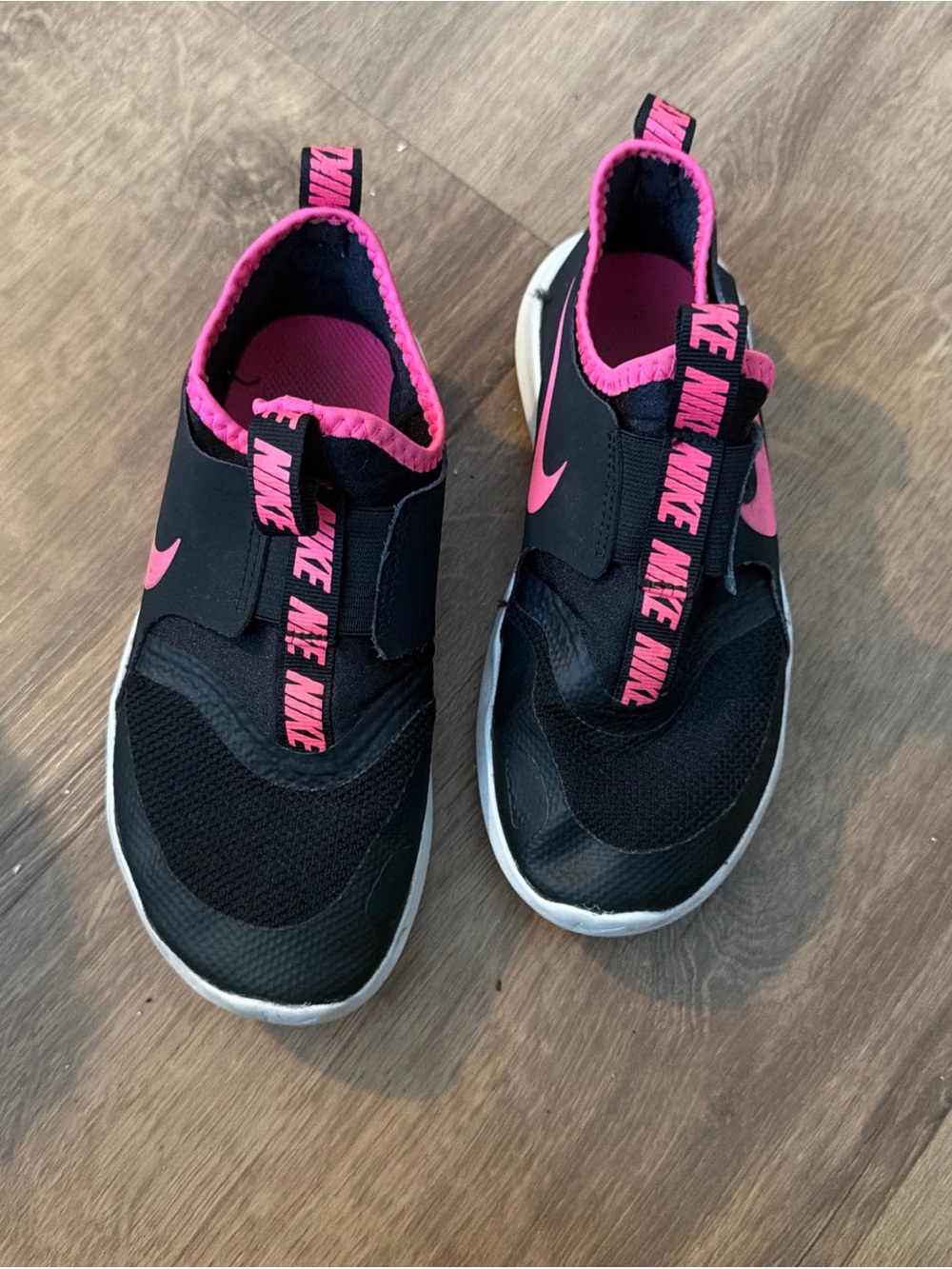 Nike Kids Black Slip-On Sneakers with Hot Pink Accents